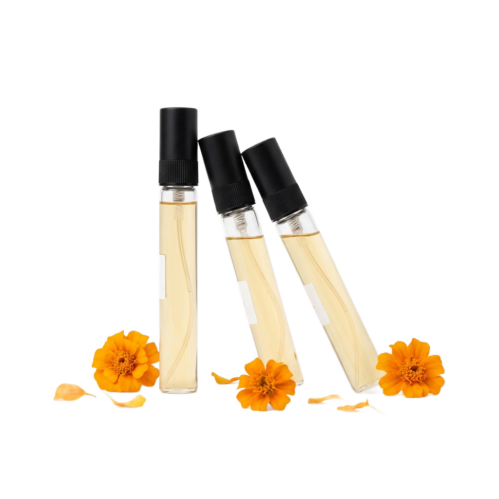 Three 10 ml glass travel sprays with marigold flowers